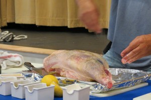 Adding pepper to the leg of lamb