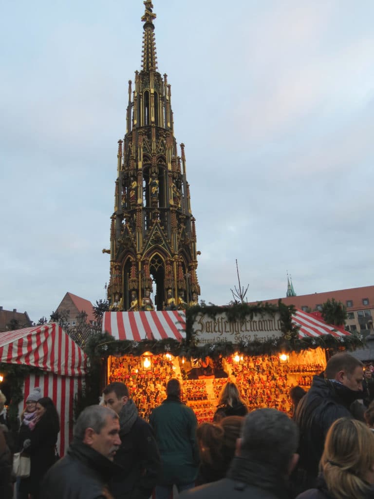 The cathedral spire looms over the Nurnberg Christmas Market in #Germany #Nuremberg #Cathedral