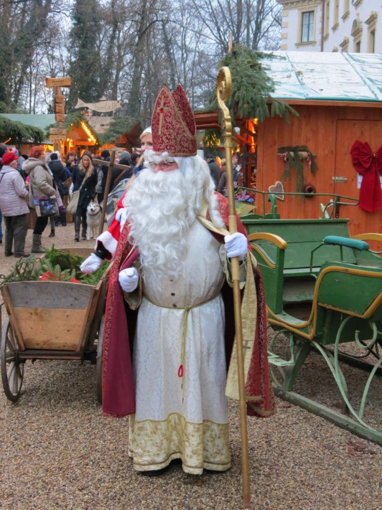 St. Nicholas pays a visit to the Thurn und Taxis Christmas Market in Regensburg, Germany to add to the fun. #Germany #Regensburg #ChristmasMarket #holidays