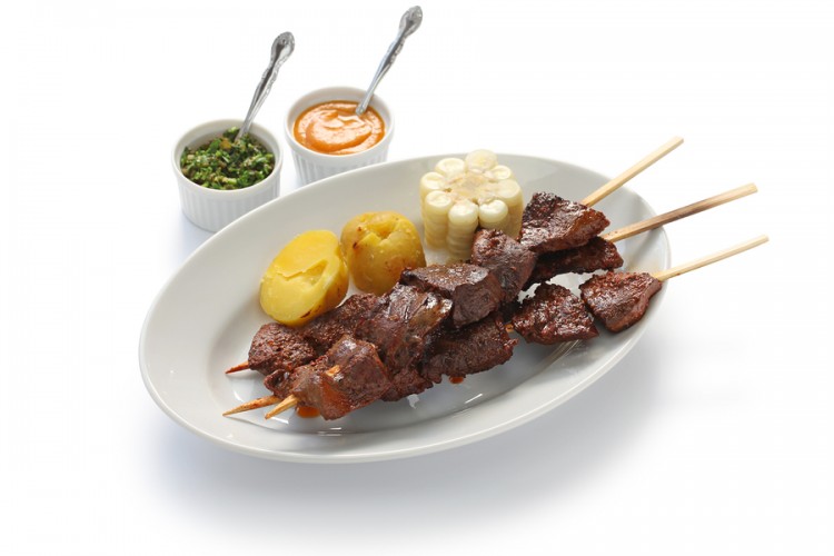 anticuchos, Peruvian cuisine, grilled skewered beef heart meat with boiled potato and white corn