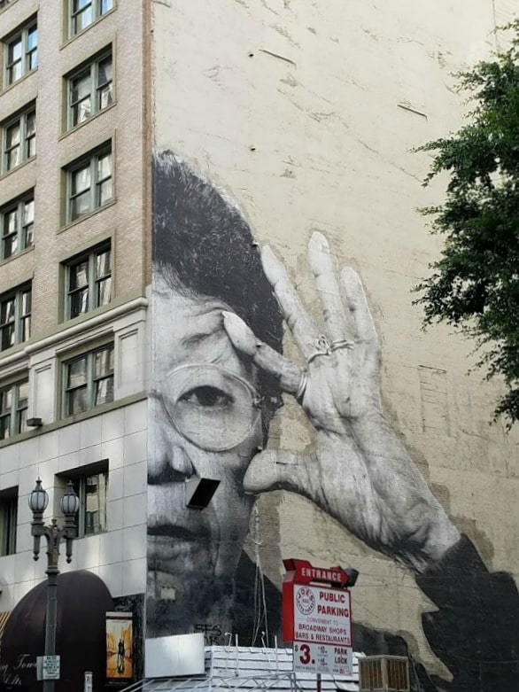 Baby Boomer Travel | Street Art | Woman with Glasses Mural