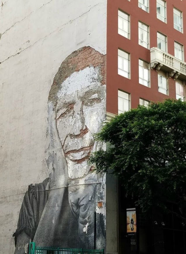 Baby Boomer Travel | Street Art | Worn Mural of Man on Wall