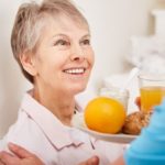 senior woman eating breakfast