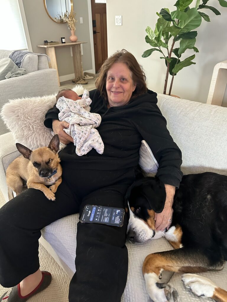 Rebecca Olkowski with baby and dogs