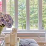 A bouquet of flowers in a sunny living room.