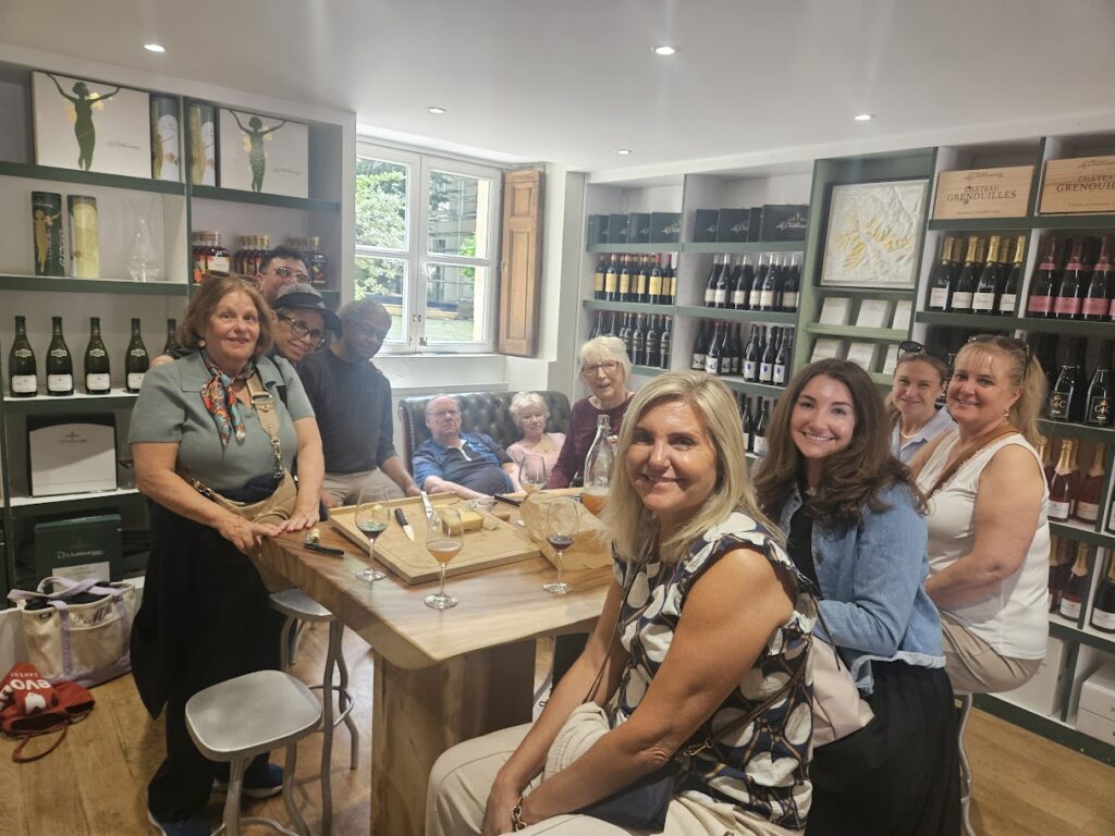 Food Tour group having a meal together in the Marais, Paris, France. With Devour Tours.