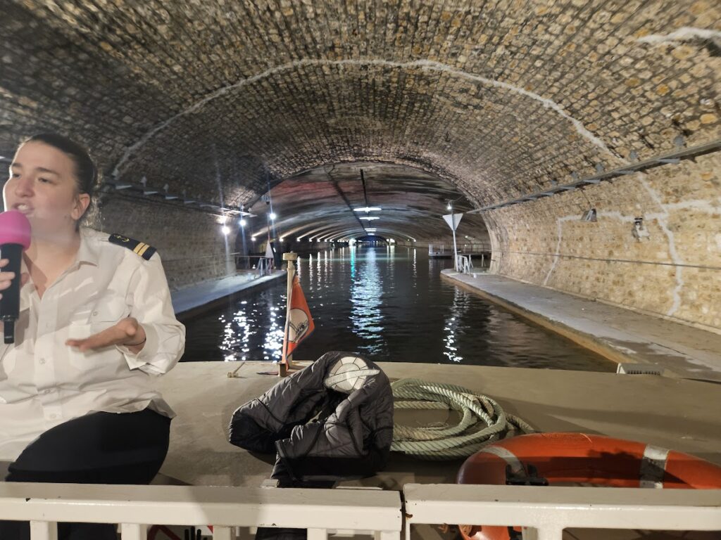 Cruising under the Canal St. Martin in Paris, France to the Seine.