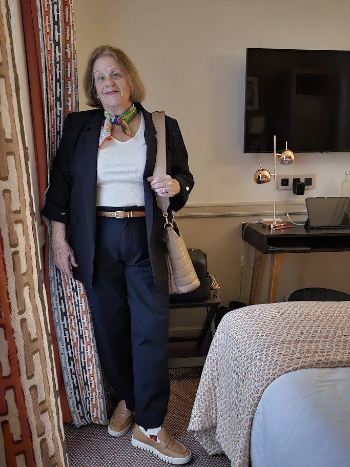 black pants and blazer with a white v neck t-shirt